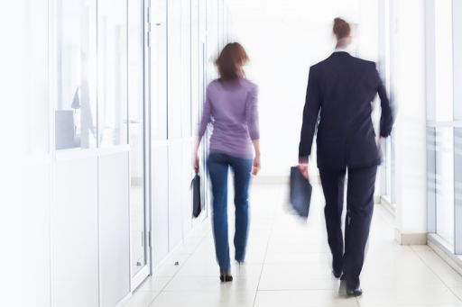 People walking in office hallway