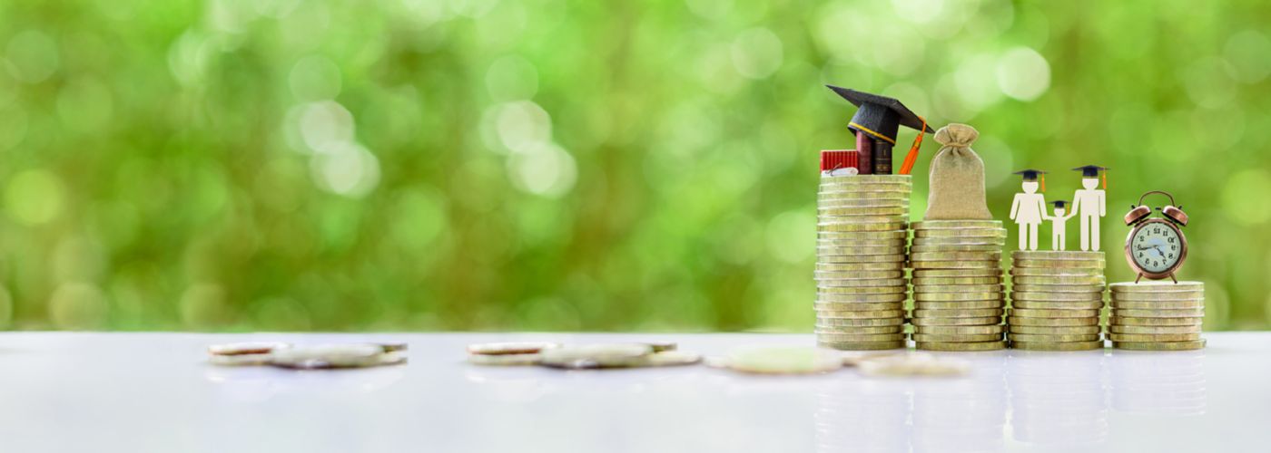 Stack of coins representing education, salary, family and personal time.