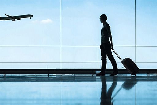 woman walking through airport