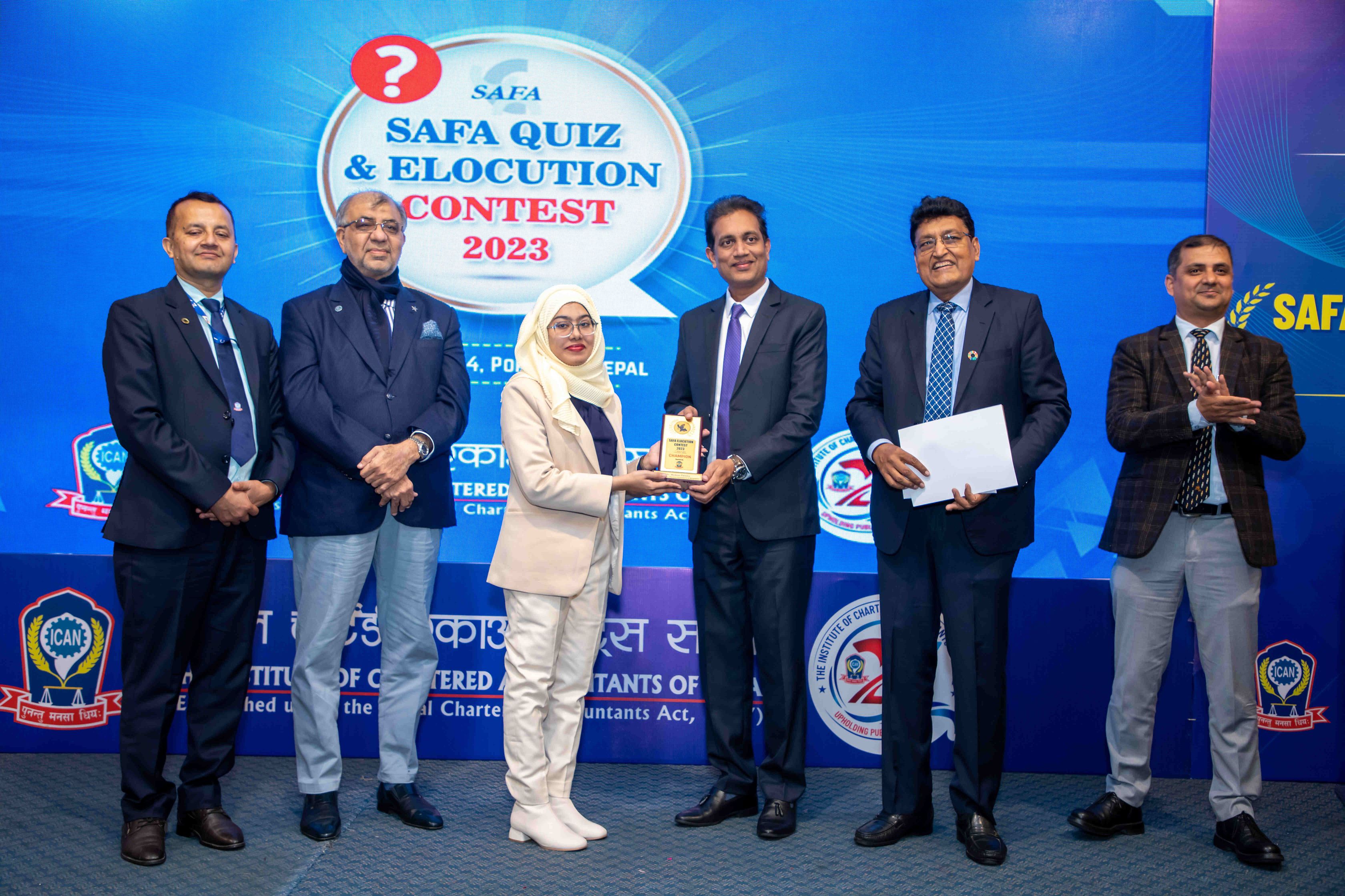 Mehnaz Fatema accepting crest for Elocution Champion