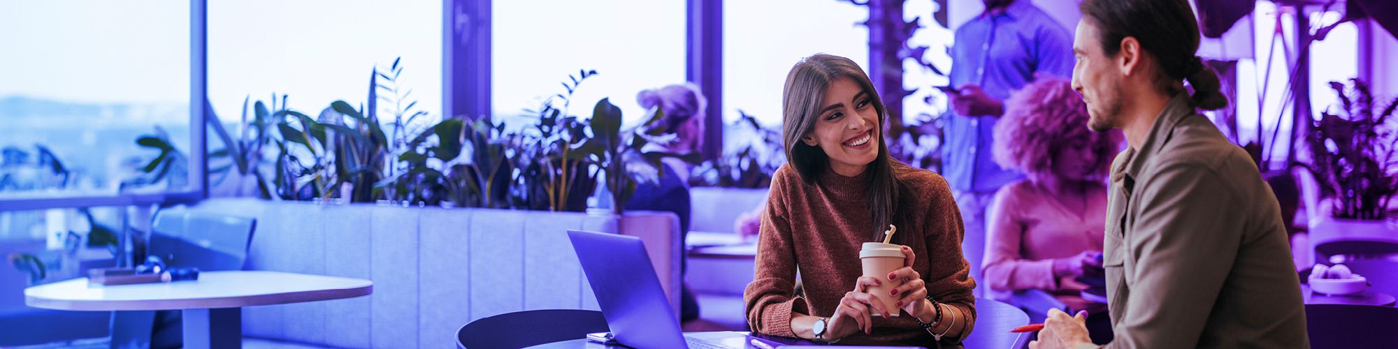 People discussing a project over coffee