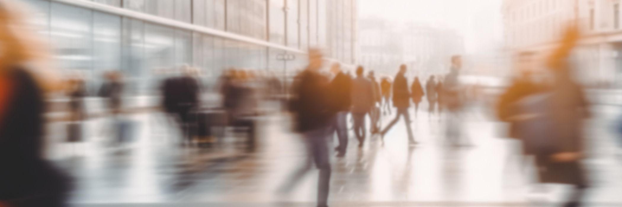 Blurry people walking on the street