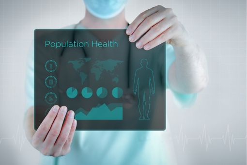 A man holds the board with the text of population health