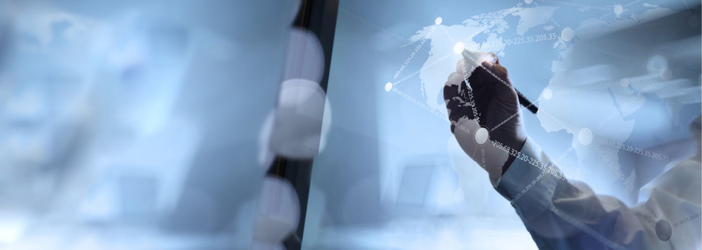 Man marking coordinates on global map