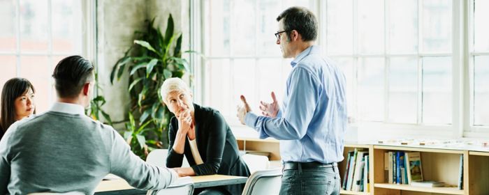 a group of people having a conversation