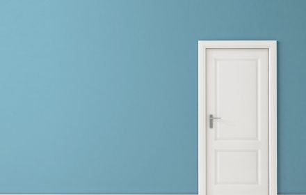 white door on blue background