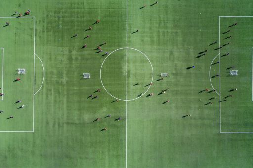 Aerial view of a soccer , football match. Football field and Footballers