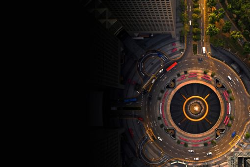 Aerial view of cars driving around a roundabout