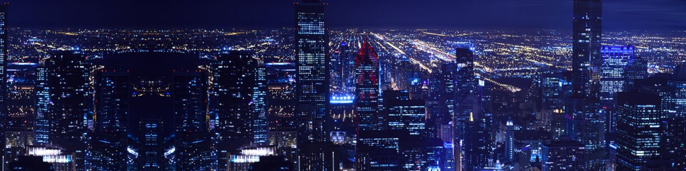 An aerial view of the city and tall building at night