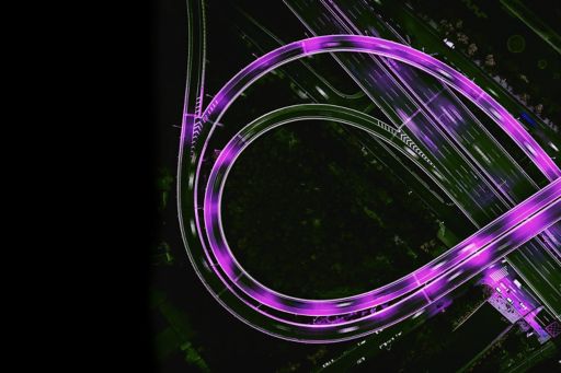 Aerial view of a highway with purple streaks
