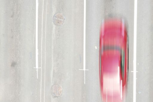 Aerial view of red car blur