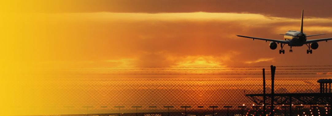 aerolane taking off overlay sunset background