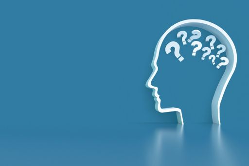 white outline of a head full of question marks sitting on a grey blue background
