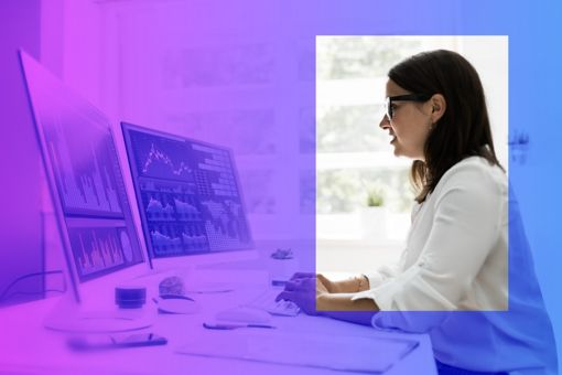 Woman sat at a desk looking at data on a computer screen, with a purple gradient overlay