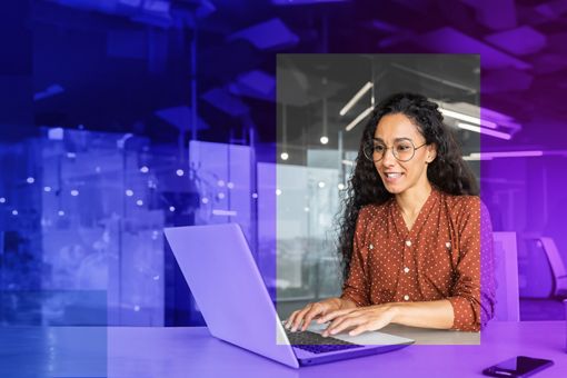 Woman sat down working on a laptop