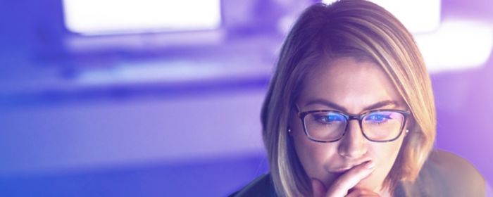 woman analysing information using a computer