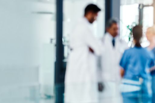 Blur doctors nurses talking