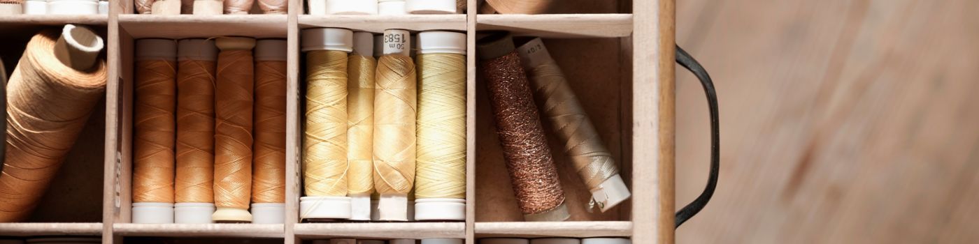 Bobbins of thread in a drawer