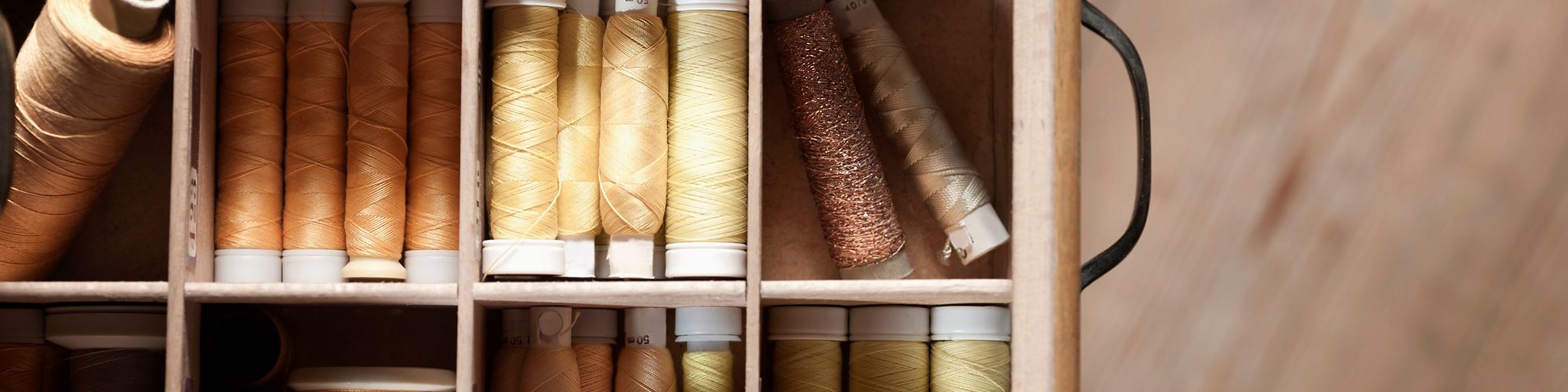 Bobbins of thread in a drawer