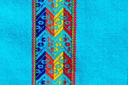 Bright blue fabric with vertical patterned design