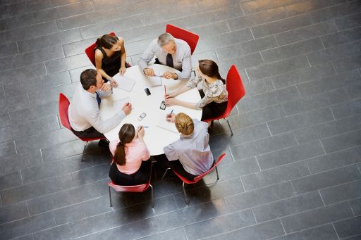 Business people having meeting at round table
