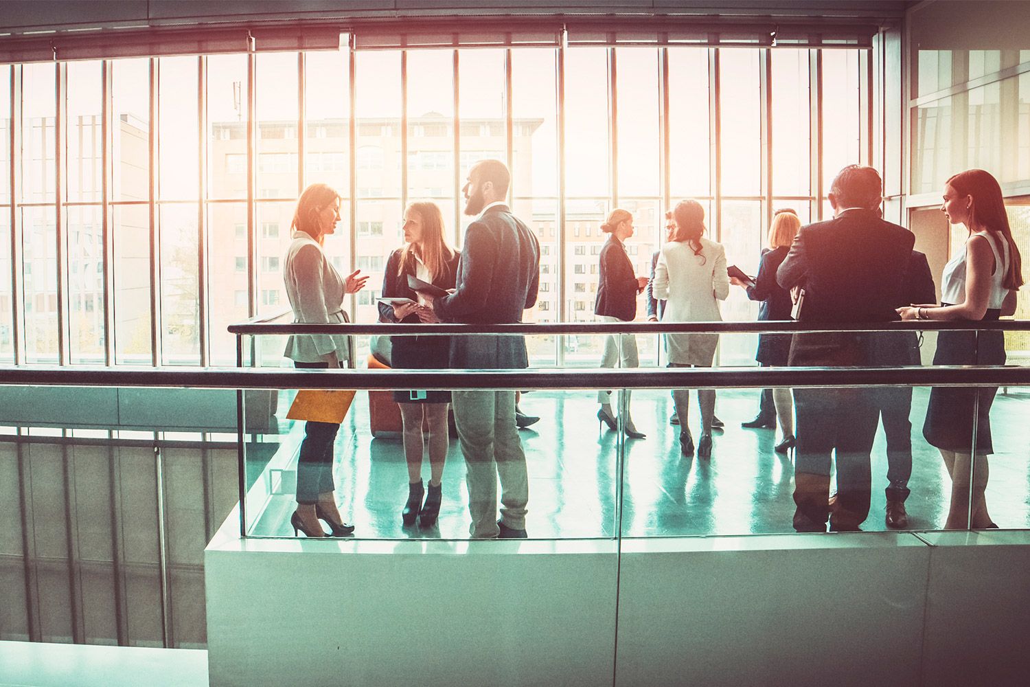 Business people talking outside meeting room