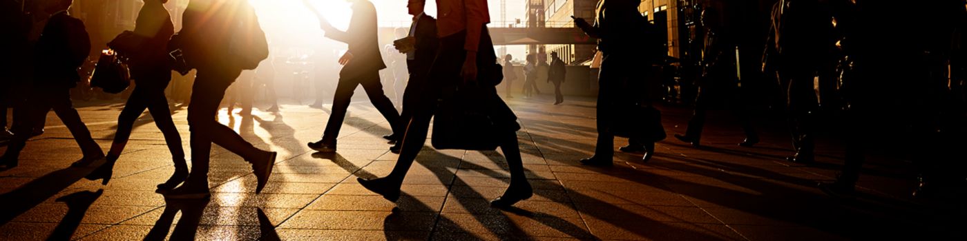 Business people walking on a pavement