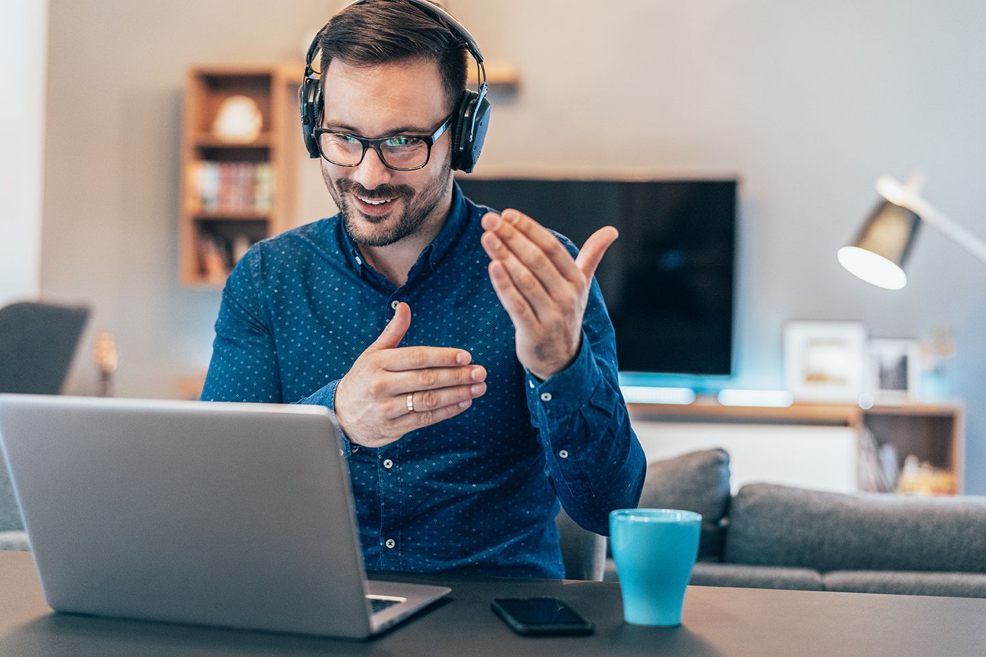 Businessman having video conference at home