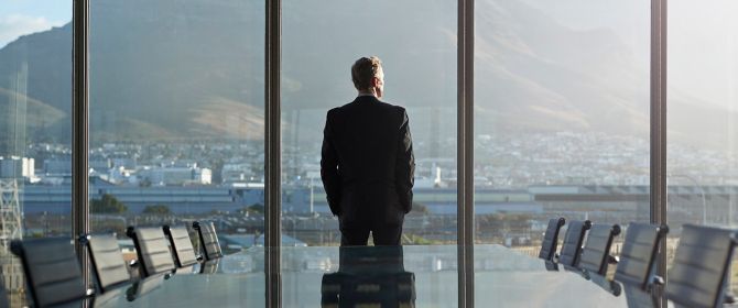 Man looking out of office