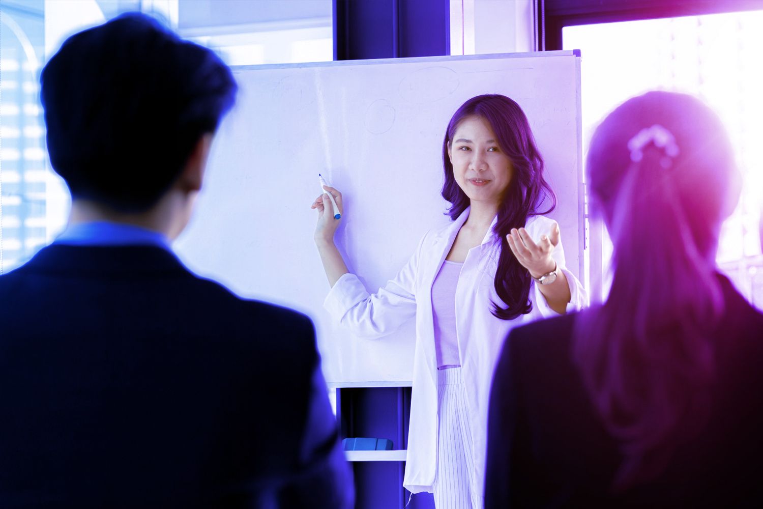 lady with marker and whiteboard