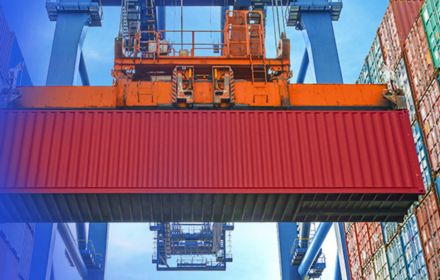 cargo containers lifting-through metallic crane banner