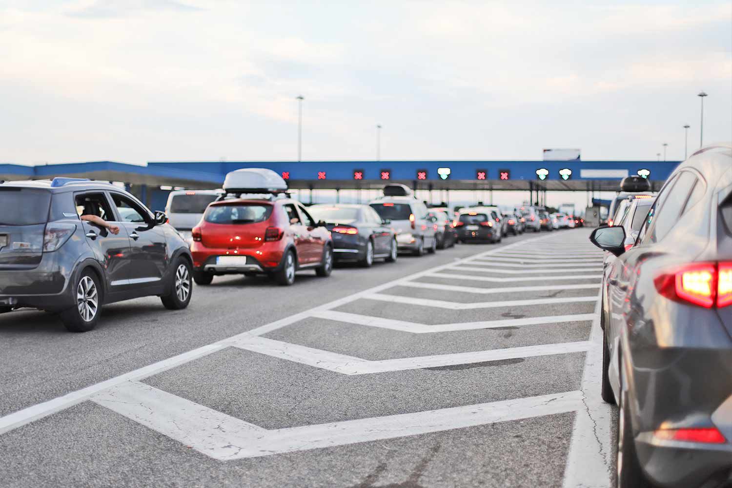 Cars lined up at a toll