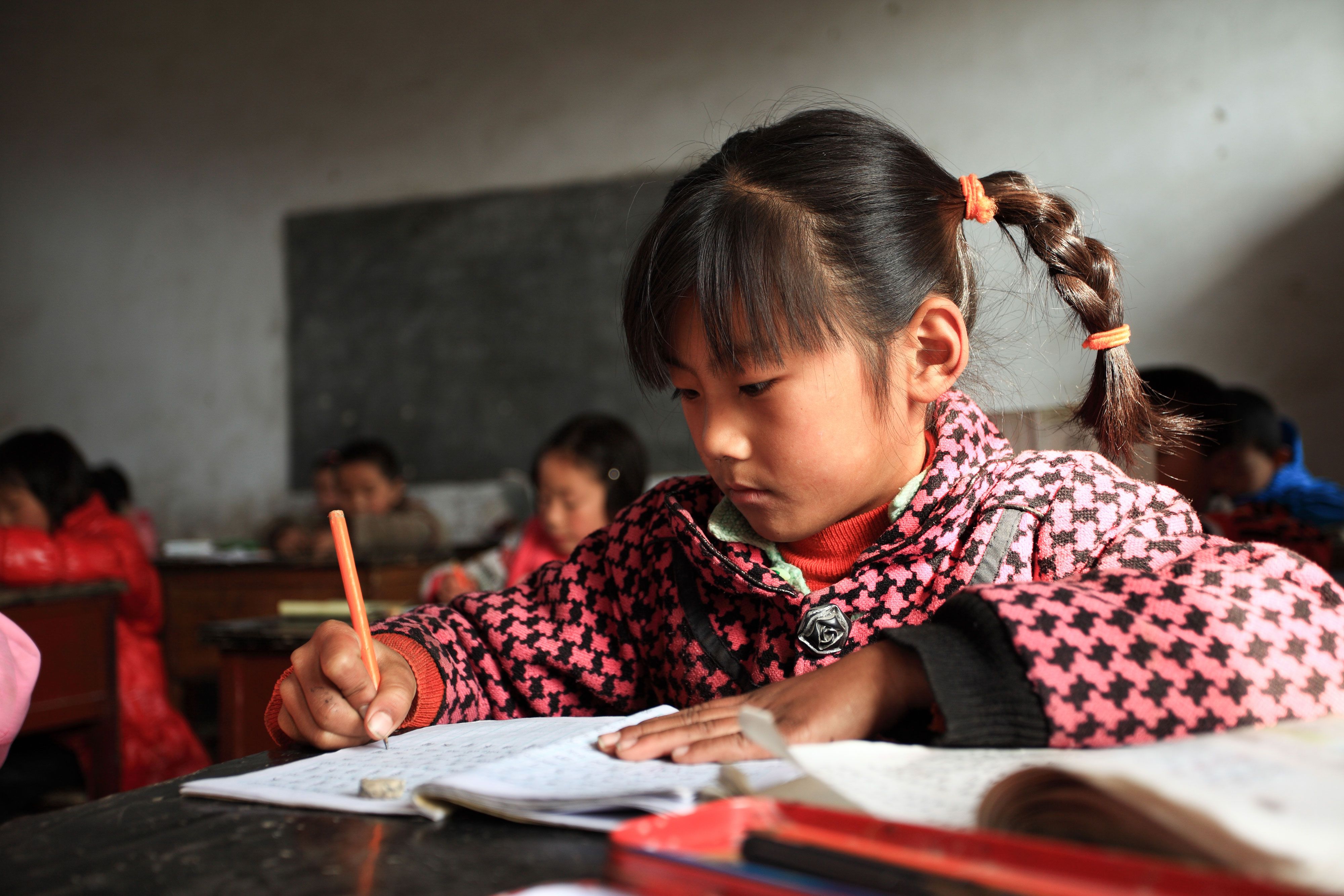 girl studying in a rural asian classroom