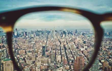 glasses looking out over city