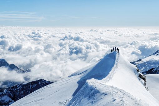 Mountain climbers on snowy peak