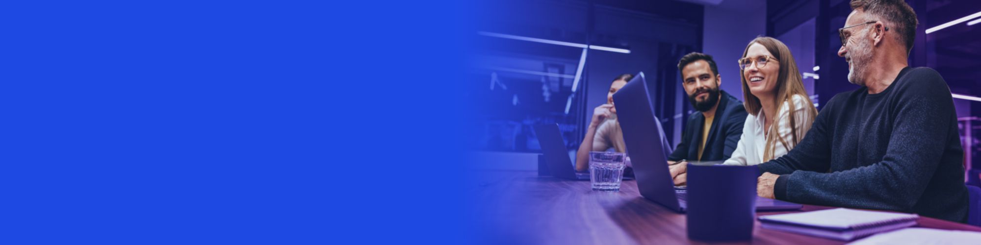 colleagues smiling laptop banner