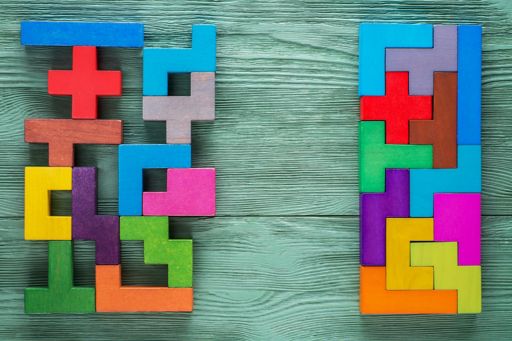 Colourful tetris blocks placed on wooden table