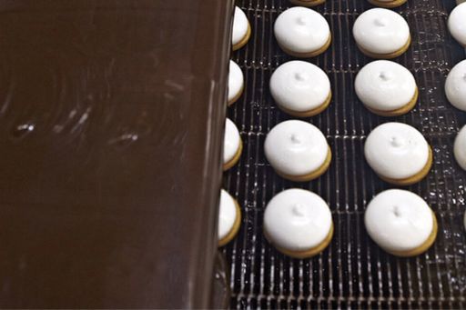 cream biscuits on conveyor belt