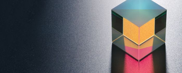 Crystal cube containing yellow and pink colours