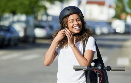 Cyclist fastening bike helmet