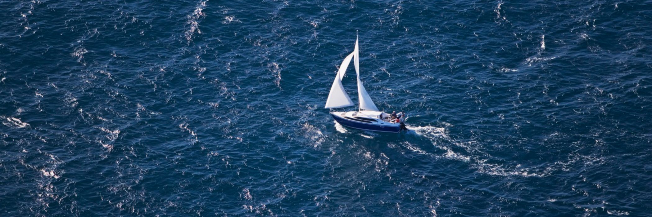 Deck boat sailing through sea