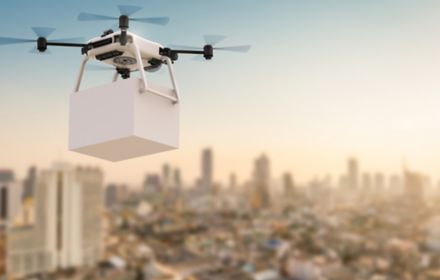 Delivery drone flying in city