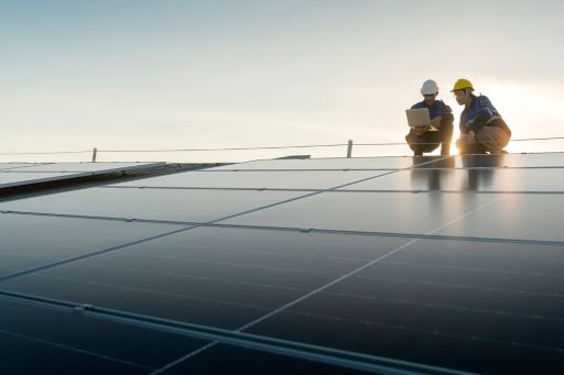 Two men working on solar panels