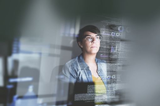 Cropped shot of a young computer programmer looking through data