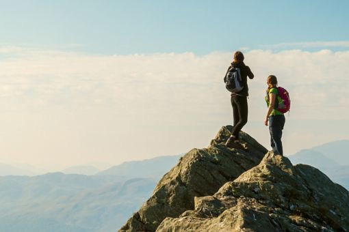 Two people standing on mountain