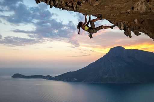 women climbing with the sea view