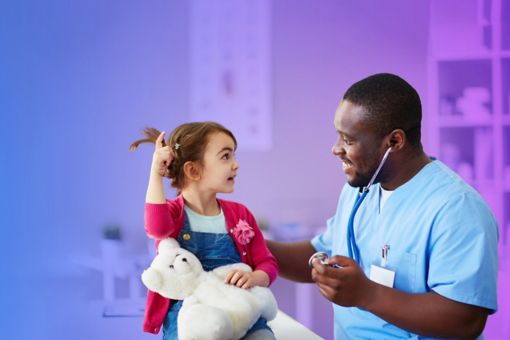 doctor and child interacting in hospital