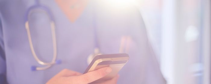doctor-looking-at-mobile-phone