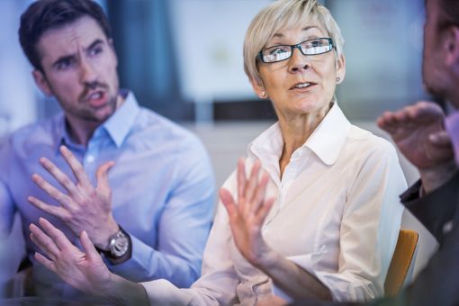 Three people in discussion