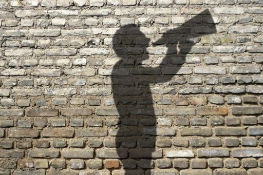 Shadow of a man with a speaking trumpet